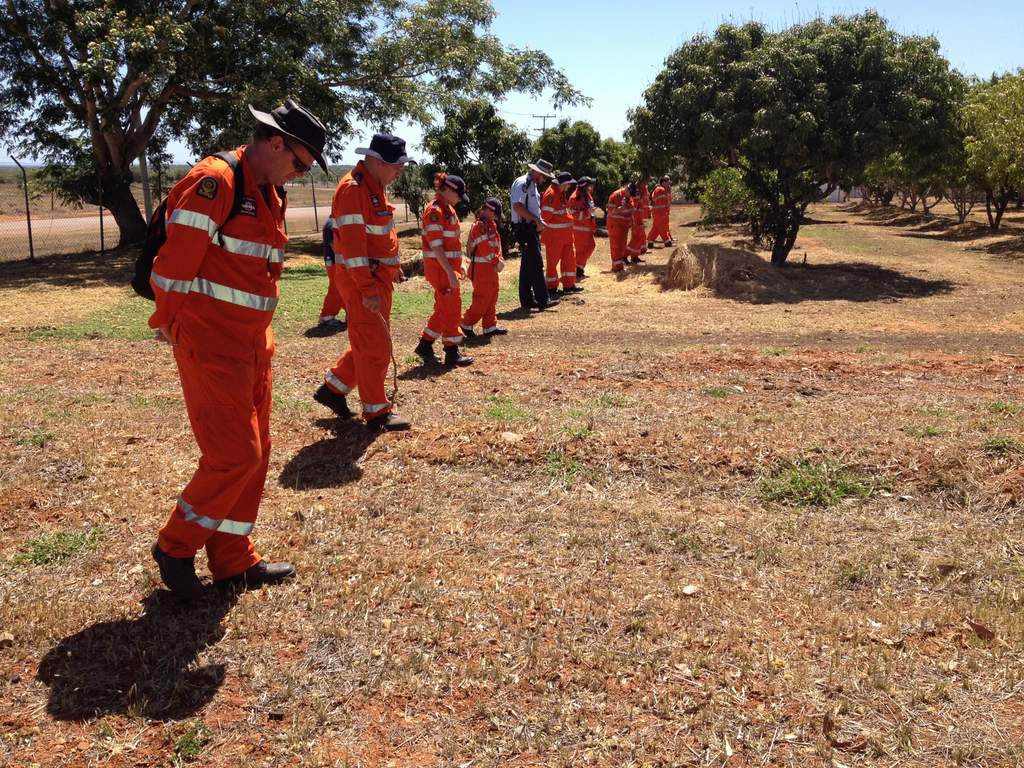 SES volunteers conduct a search. SES volunteers conduct a search.