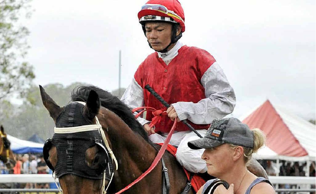 RIGHT: Black Patch, with Marlon Dolendo aboard, is led back to scale after the Tabulam Cup. Dolendo came in under-weight and Black Patch was disqualified, gifting the win to second-past-the-post Falontino. RIGHT: Black Patch, with Marlon Dolendo aboard, is led back to scale after the Tabulam Cup. Dolendo came in under-weight and Black Patch was disqualified, gifting the win to second-past-the-post Falontino.