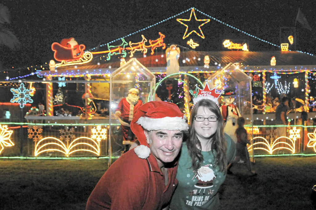 A previous Christmas lights winner Ray Dole and his daughter Belinda Rimmington outside Ray’s Fairview Drive Christmas lights display. A previous Christmas lights winner Ray Dole and his daughter Belinda Rimmington outside Ray’s Fairview Drive Christmas lights display.