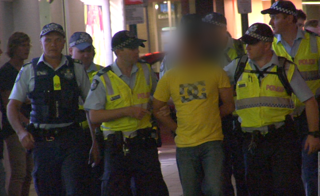 Police arrest a man in Surfers Paradise on the eve of Schoolies 2012. Police arrest a man in Surfers Paradise on the eve of Schoolies 2012.