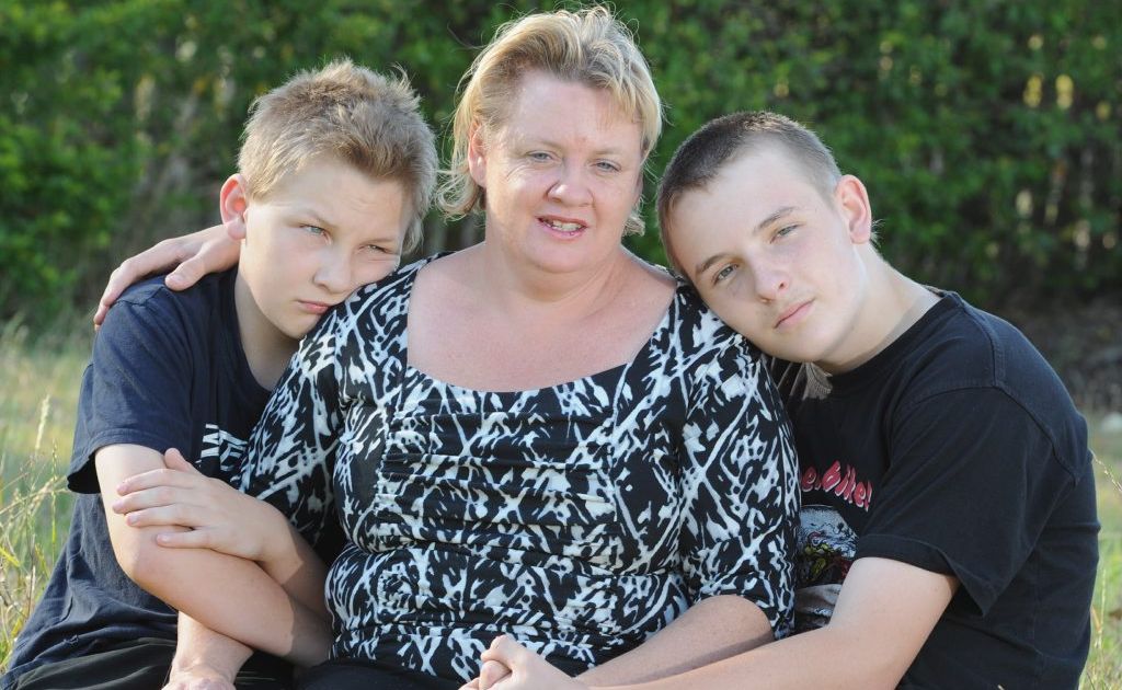 Benjamin Joynson, 13, with his mother Kim and brother Jonathon, 15, comfort each other as they remember their father and husband Willie who died in the Pike River Mine disaster in 2010. Benjamin Joynson, 13, with his mother Kim and brother Jonathon, 15, comfort each other as they remember their father and husband Willie who died in the Pike River Mine disaster in 2010.