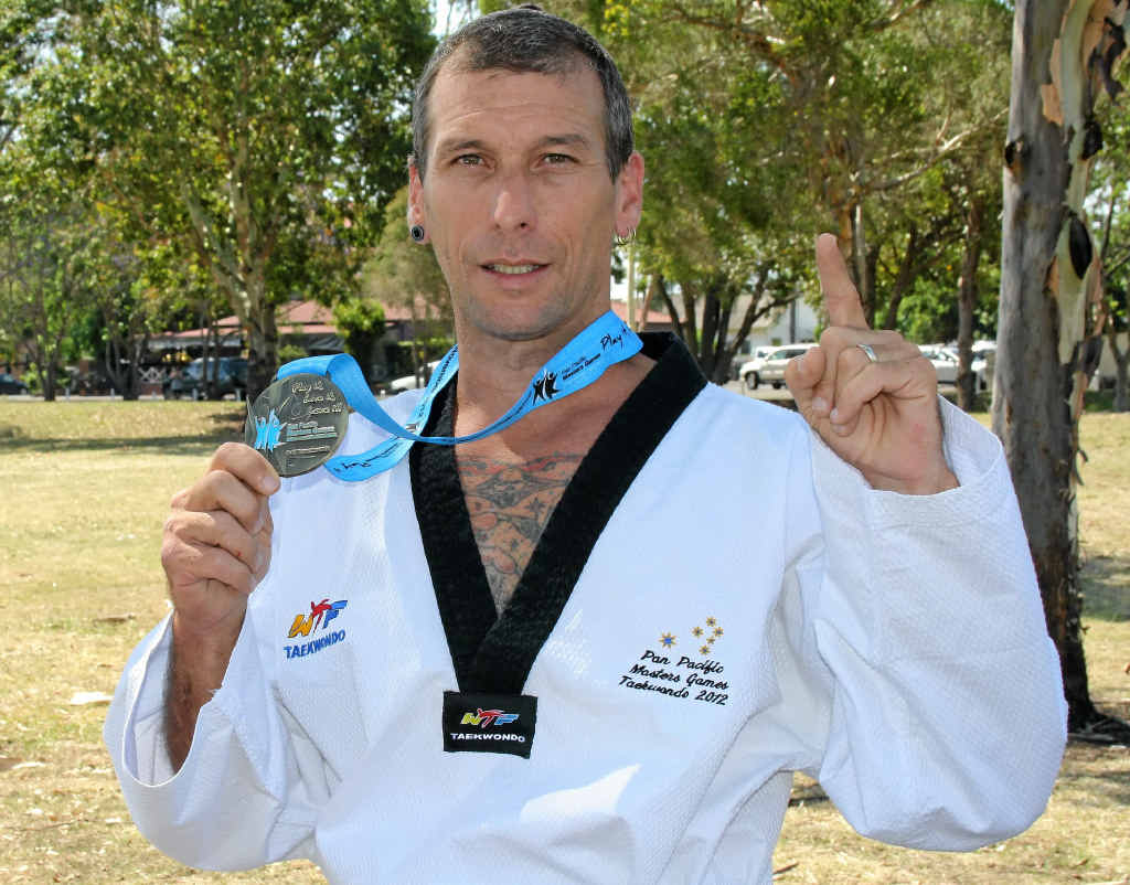 FIGHTING SKILL: Guy Hubert fought hard to claim gold in the tae kwon do at the 8th Pan Pacific Masters Games on the Gold Coast. FIGHTING SKILL: Guy Hubert fought hard to claim gold in the tae kwon do at the 8th Pan Pacific Masters Games on the Gold Coast.