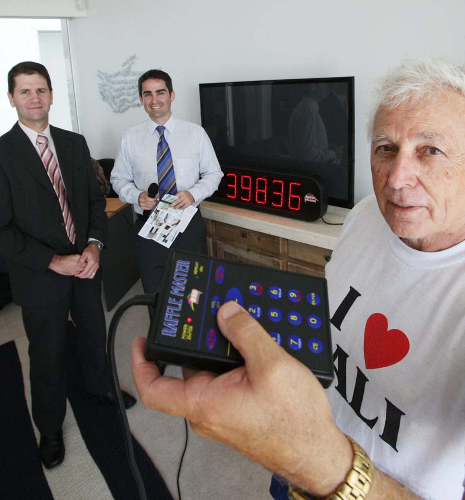 George Michael gets ready to hit the button while Leon Nantes and Luke Traini look on.