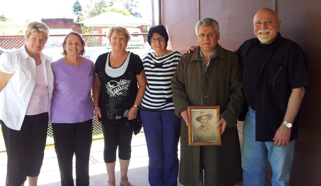 The war coat handover (L-R): Sharon Barrett, Laraine Vellozzi, Merrian Ross, Katina Comino, Peter Comino and John Comino. The war coat handover (L-R): Sharon Barrett, Laraine Vellozzi, Merrian Ross, Katina Comino, Peter Comino and John Comino.
