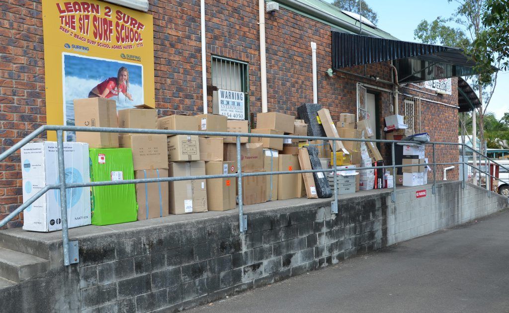 Parcels awaiting delivery piled up at the rear of the Agnes Water Post Office. Parcels awaiting delivery piled up at the rear of the Agnes Water Post Office.