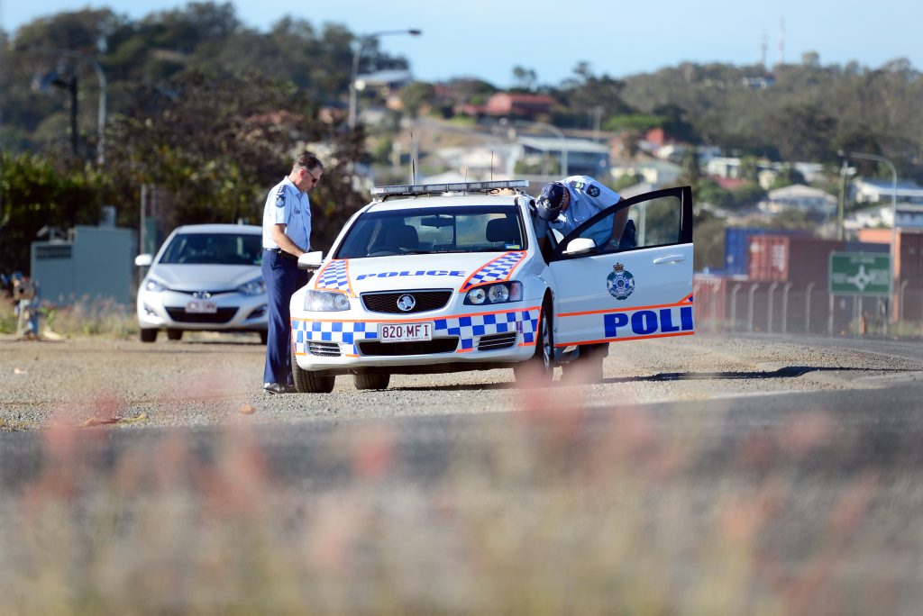 Police monitor traffic near a union protest outside QCLNG on Port Curtis Way. Police monitor traffic near a union protest outside QCLNG on Port Curtis Way.