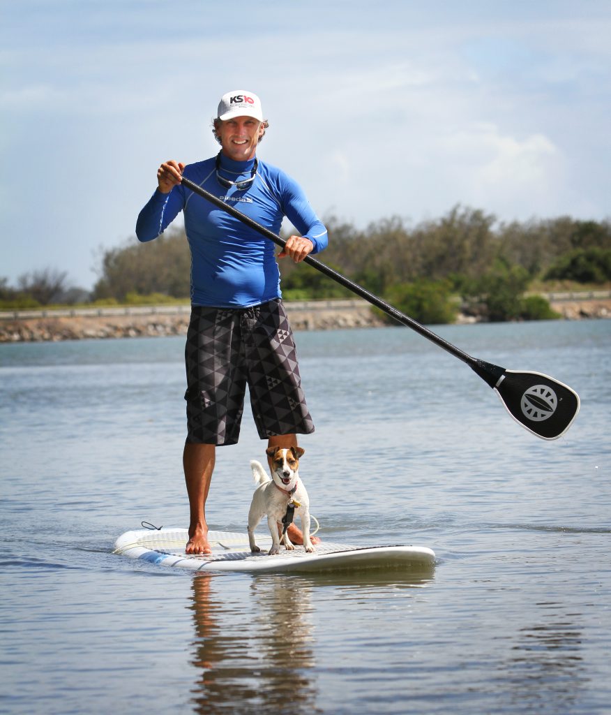 Pat Eastwood and his dog Ally on a stand up paddle board. Photo Allan Reinikka / The Morning Bulletin