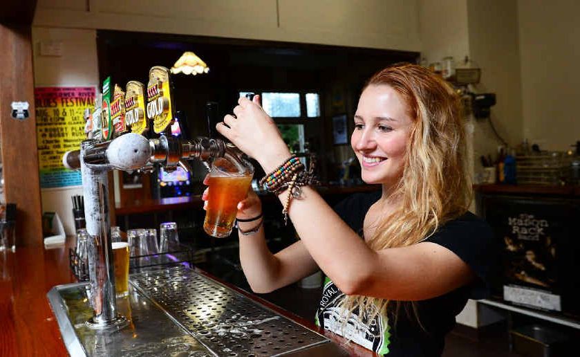 ICONIC PUB: Addie Cafe pours a beer. ICONIC PUB: Addie Cafe pours a beer.