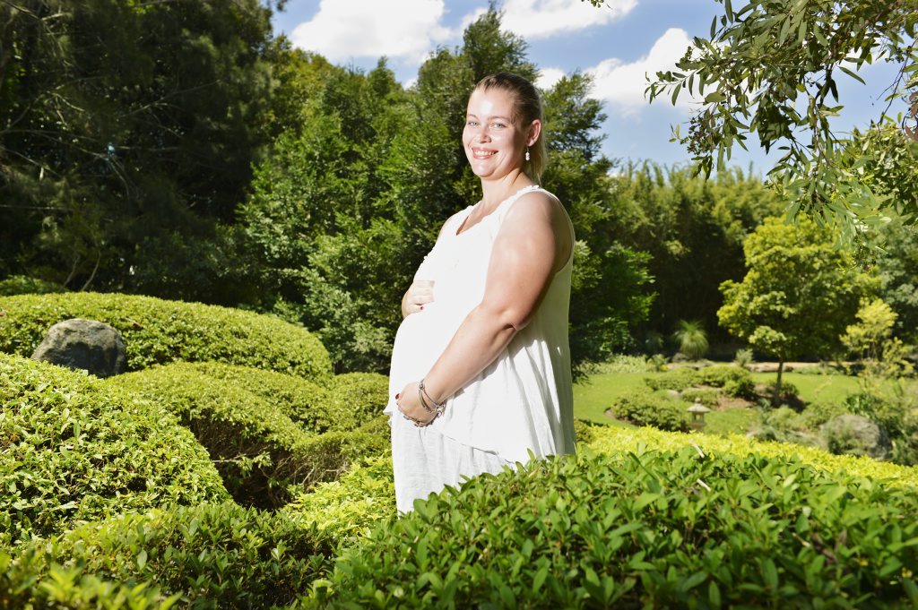Image for sale: Naomi Steinhardt embraces her baby bump in Nerima Gardens in Queens Park. Catherine, Duchess of Cambridge is reported to be pregnant and suffering with morning sickness. Photo: Claudia Baxter / The Queensland Times