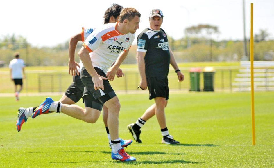 Besart Berisha (closest to camera) sprints under the gaze of coach Rado Vidosic, during a Brisbane Roar team training session at Stockland Stadium. Besart Berisha (closest to camera) sprints under the gaze of coach Rado Vidosic, during a Brisbane Roar team training session at Stockland Stadium.
