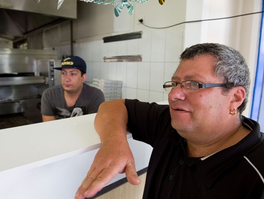 Malla & Sons Pizza and Pasta owner Giovanni Mallamaci (right) and son Joshua were threatened with a knife during an attempted armed. Malla & Sons Pizza and Pasta owner Giovanni Mallamaci (right) and son Joshua were threatened with a knife during an attempted armed.
