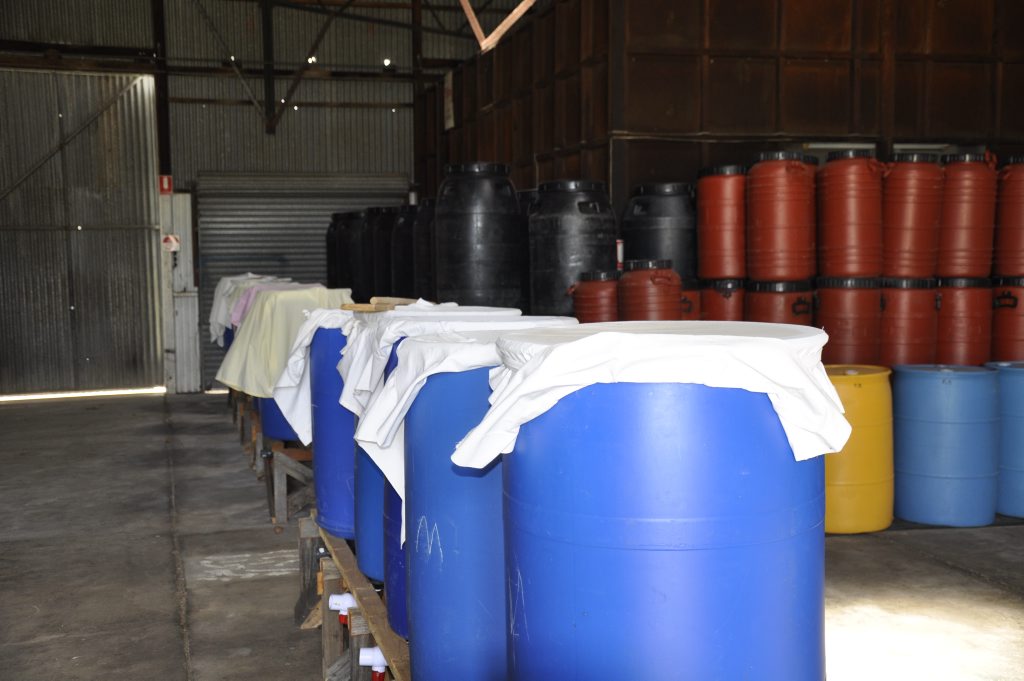 Inside the Earthmother Emissary Council at Allora. Drums used to ferment a range of products including detergent and agricultural products. Inside the Earthmother Emissary Council at Allora. Drums used to ferment a range of products including detergent and agricultural products.