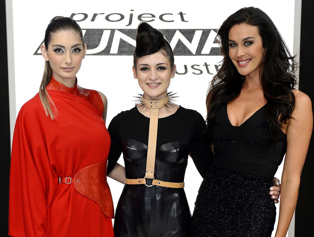 Project Runway winner Christina Exie pictured with host Megan Gale, right, and a model wearing a piece from her winning collection. Project Runway winner Christina Exie pictured with host Megan Gale, right, and a model wearing a piece from her winning collection.
