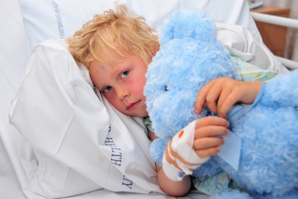 Lochlan Johns, 6, recovering in Nambour Hospital after stitches to the back of his head and superficial facial injuries after dog bites at Buddina Beach. Lochlan Johns, 6, recovering in Nambour Hospital after stitches to the back of his head and superficial facial injuries after dog bites at Buddina Beach.