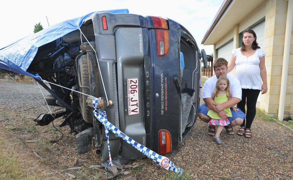 Kerry and Shane Mandrek and daughter Jessica (3) with their wrecked family vehicle. Kerry and Shane Mandrek and daughter Jessica (3) with their wrecked family vehicle.