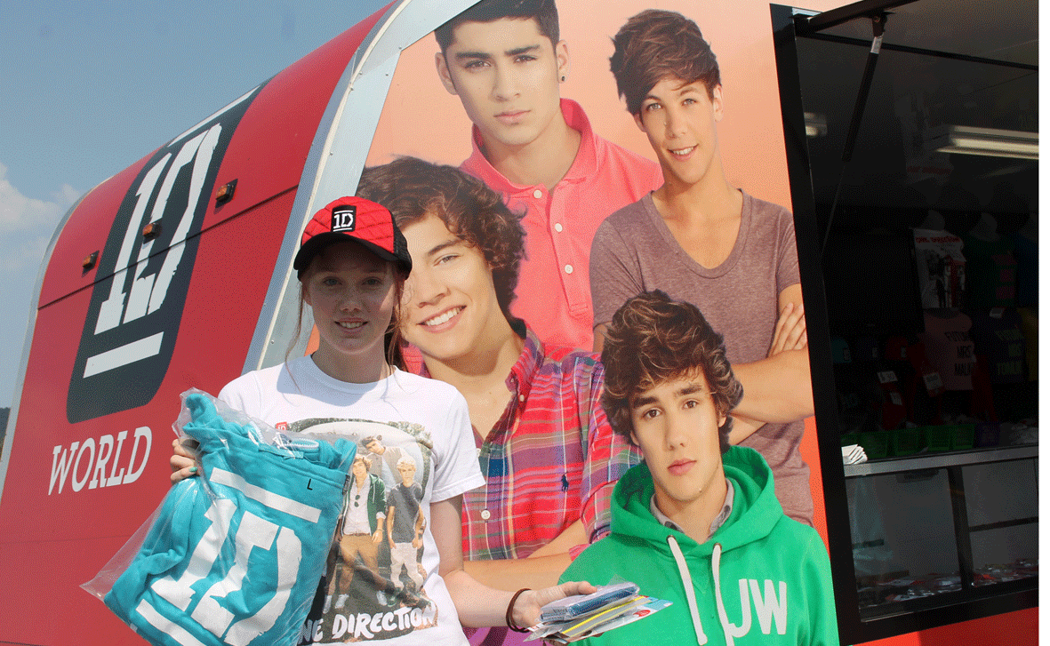 One Direction fan Xaviera Hobson was the first in line to purchase official merchandise at the impressive travelling merchandise store on Tuesday.
One Direction fan Xaviera Hobson was the first in line to purchase official merchandise at the impressive travelling merchandise store on Tuesday.