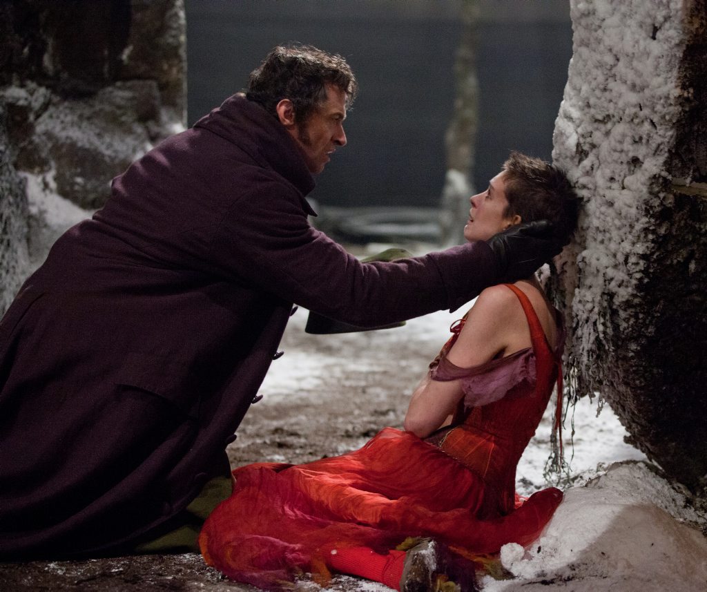Hugh Jackman and Anne Hathaway in a scene from the movie Les Miserables. Hugh Jackman and Anne Hathaway in a scene from the movie Les Miserables.