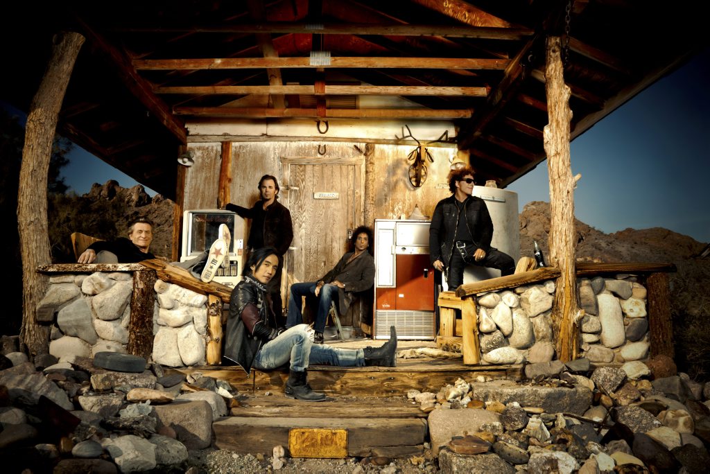 The band Journey, from left, Ross Valory, Jonathan Cain, Arnel Pineda (sitting), Deen Castronovo and Neal Schon. The band Journey, from left, Ross Valory, Jonathan Cain, Arnel Pineda (sitting), Deen Castronovo and Neal Schon.