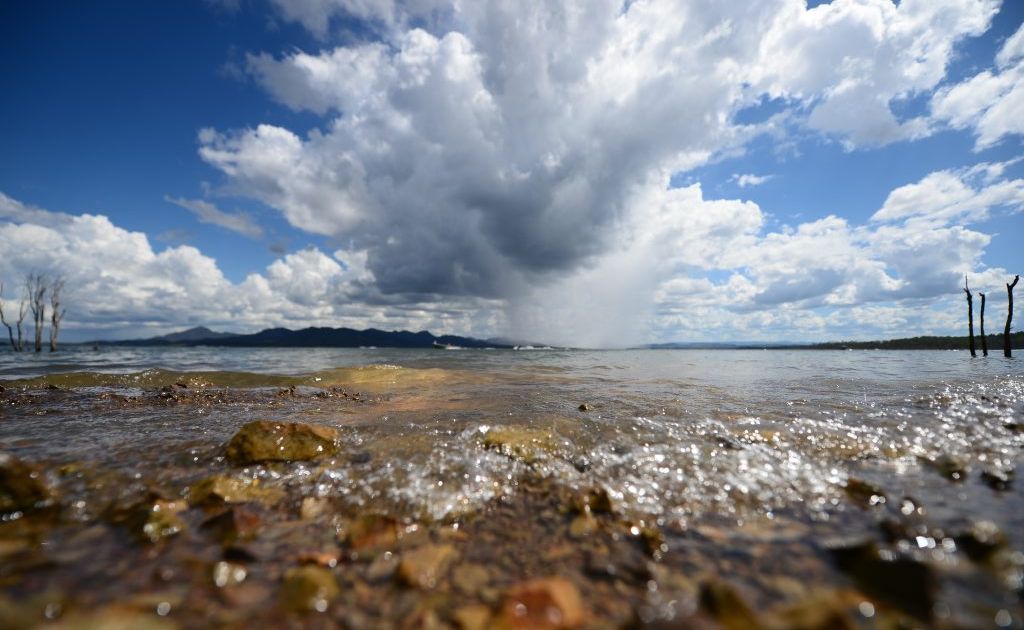 Lake Awoonga Dam. A funnel of rain coming over the mountains. Lake Awoonga Dam. A funnel of rain coming over the mountains.