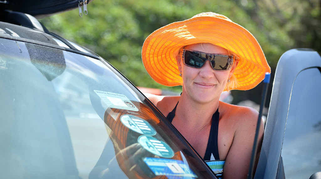 Kristie Bazley puts a permit sticker on her vehicle before heading to Double island Point. Kristie Bazley puts a permit sticker on her vehicle before heading to Double island Point.