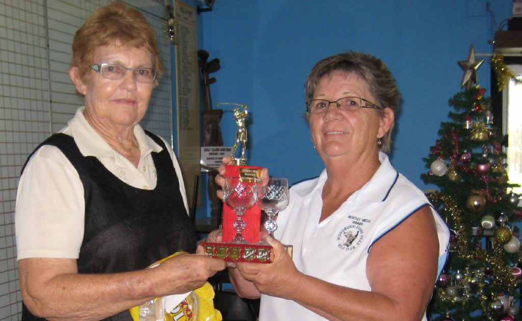 GOLF AWARD: Evans Head Ladies’ Golf captain and club champion Jo Hennessy (right) presents Betty Hancock with her trophy for Medal of Medals Winner. GOLF AWARD: Evans Head Ladies’ Golf captain and club champion Jo Hennessy (right) presents Betty Hancock with her trophy for Medal of Medals Winner.