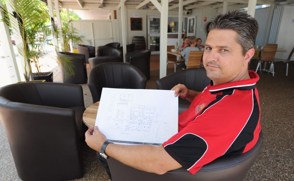 Beach House Hotel manager Paul Robins in the newly revamped beer garden with plans for the hotel's rebuild. Beach House Hotel manager Paul Robins in the newly revamped beer garden with plans for the hotel's rebuild.