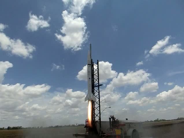 The RASTA rocket launches from a Pampas paddock.