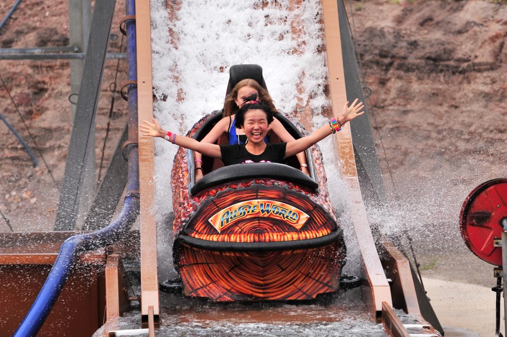 Eli Imaminato, 14, from Japan enjoys a soaking on the log flume ride at Aussie World, with Demi Woodford, 12, from Noosa behind. Photo: Iain Curry / Sunshine Coast Daily Eli Imaminato, 14, from Japan enjoys a soaking on the log flume ride at Aussie World, with Demi Woodford, 12, from Noosa behind. Photo: Iain Curry / Sunshine Coast Daily
