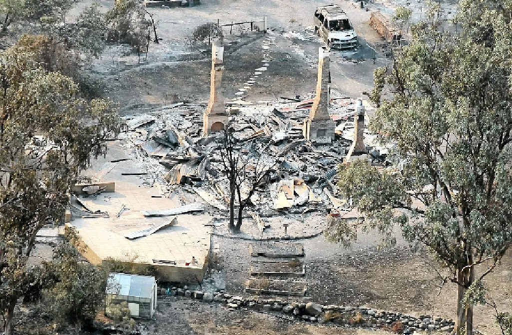 TERRIBLE SIGHT: A house damaged by a bushfire is seen from a helicopter in Dunalley, Tasmania, yesterday. TERRIBLE SIGHT: A house damaged by a bushfire is seen from a helicopter in Dunalley, Tasmania, yesterday.