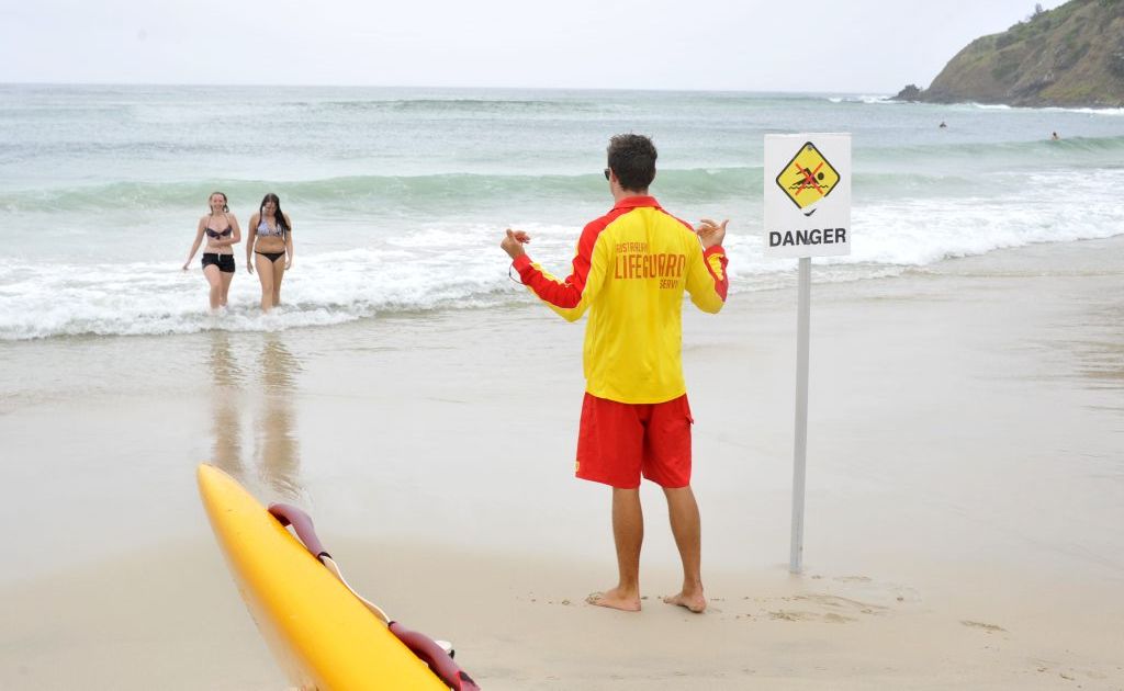 Tom Burns, Byron Bay lifeguard, putting up a sign to warn people not to go swimming at Watego. Sharks have been sighted. Swimmers (LtoR) Maxine Willis and Keeley Thomas of Alstonville are getting out of the water. Tom Burns, Byron Bay lifeguard, putting up a sign to warn people not to go swimming at Watego. Sharks have been sighted. Swimmers (LtoR) Maxine Willis and Keeley Thomas of Alstonville are getting out of the water.