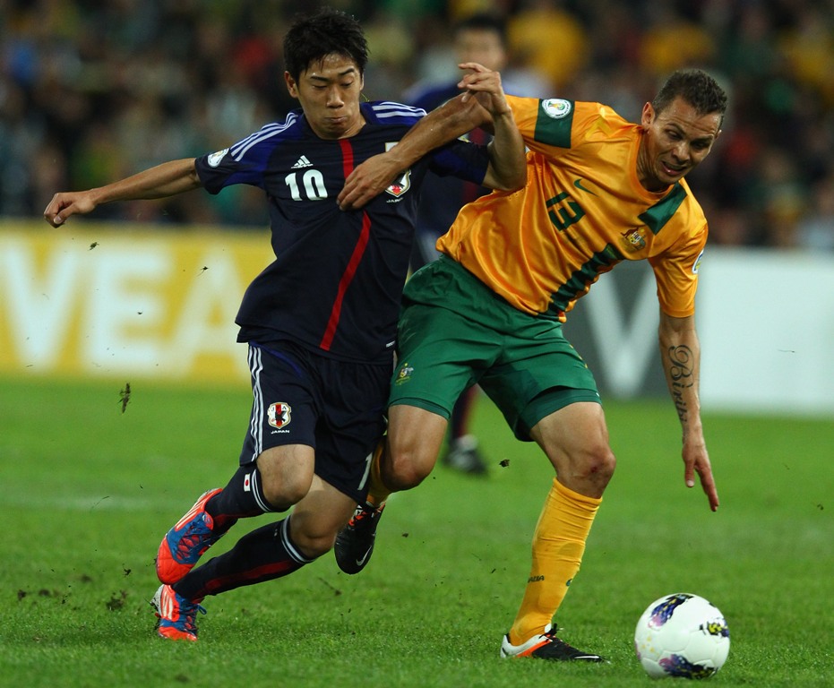 Shinji Kagawa of Japan is challenged by Jade North of Australia during the FIFA World Cup Asian Qualifier match between the Australian Socceroos and Japan at Suncorp Stadium on June 12, 2012 in Brisbane, Australia. Shinji Kagawa of Japan is challenged by Jade North of Australia during the FIFA World Cup Asian Qualifier match between the Australian Socceroos and Japan at Suncorp Stadium on June 12, 2012 in Brisbane, Australia.