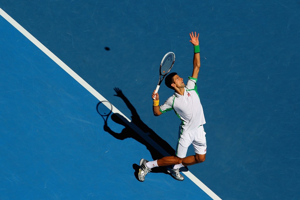 Novak Djokovic of Serbia serves in his first round match against Paul-Henri Mathieu of France during day one of the 2013 Australian Open at Melbourne Park on January 14, 2013 in Melbourne, Australia. Novak Djokovic of Serbia serves in his first round match against Paul-Henri Mathieu of France during day one of the 2013 Australian Open at Melbourne Park on January 14, 2013 in Melbourne, Australia.