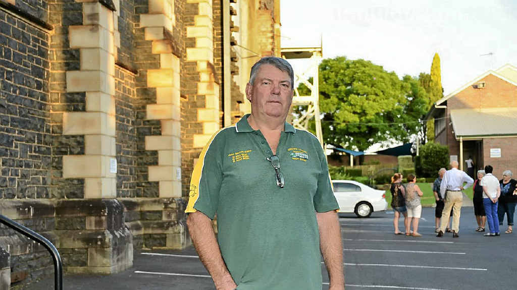 PROTEST: Truckie George Johnson at St Lukes church, hundreds packed the meeting and one of the protesters with a McDeath shirt. PROTEST: Truckie George Johnson at St Lukes church, hundreds packed the meeting and one of the protesters with a McDeath shirt.