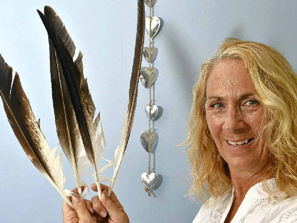 Psychic Jannine Umana says feather spirit readings have won over the wary. Psychic Jannine Umana says feather spirit readings have won over the wary.