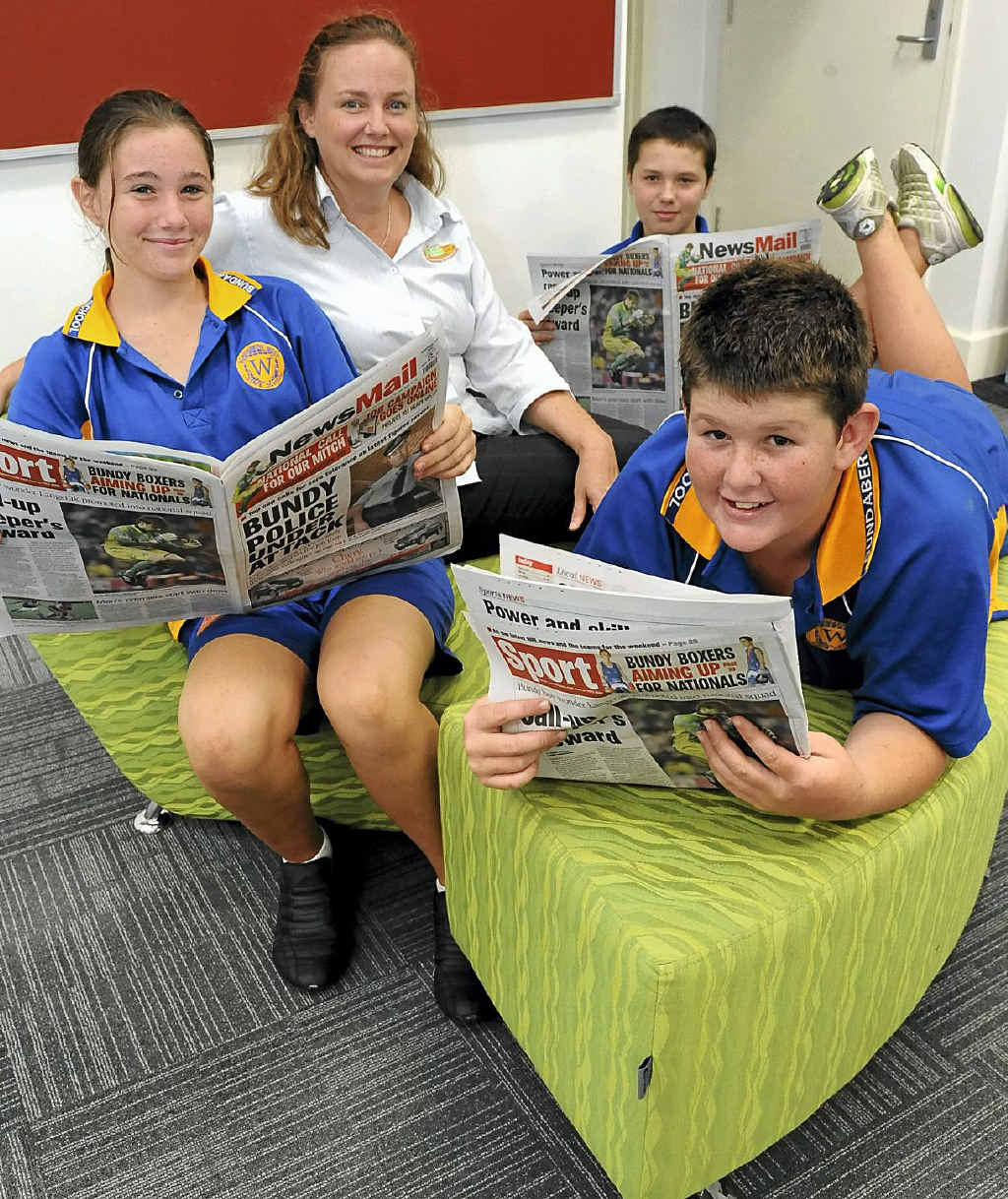 Stacey Muir, Newspapers in Education editor Robyn Courtney, (back) Dakota Biggs and (front) James Watson learn more about newspapers.