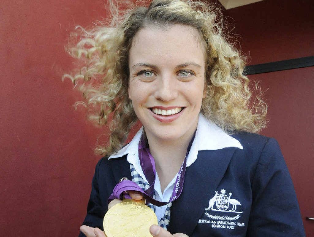 Paralympian Jacqueline Freney shows one of her medals. Paralympian Jacqueline Freney shows one of her medals.