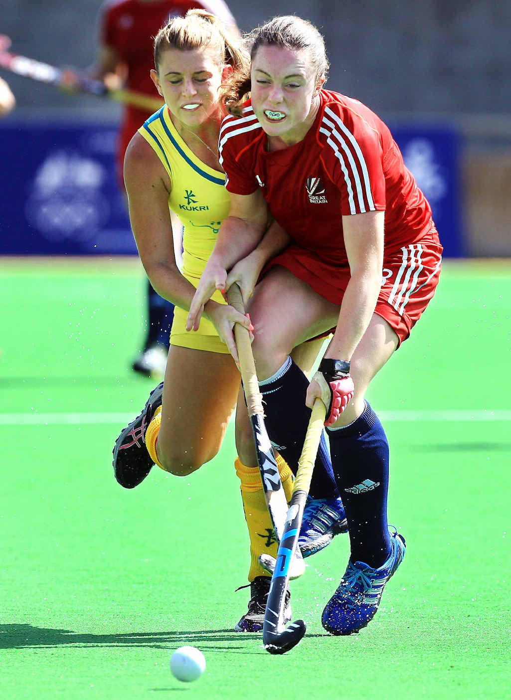 Australia's Jordyn Holzberger and Grace Balsdon of GB battle for the ball during the Women's Hockey match on day one of the 2013 Australian Youth Olympic Festival. Australia's Jordyn Holzberger and Grace Balsdon of GB battle for the ball during the Women's Hockey match on day one of the 2013 Australian Youth Olympic Festival.
