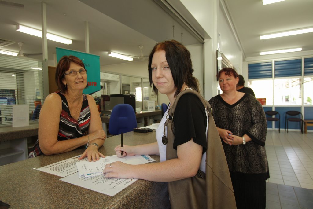 Brittany Hockenhull, 17, enrolling at Wide Bay Institute of TAFE to do a Certificate III in Beauty Services with TAFE customer service officer Jan Noble and her mother Teresa Hockenhull.
