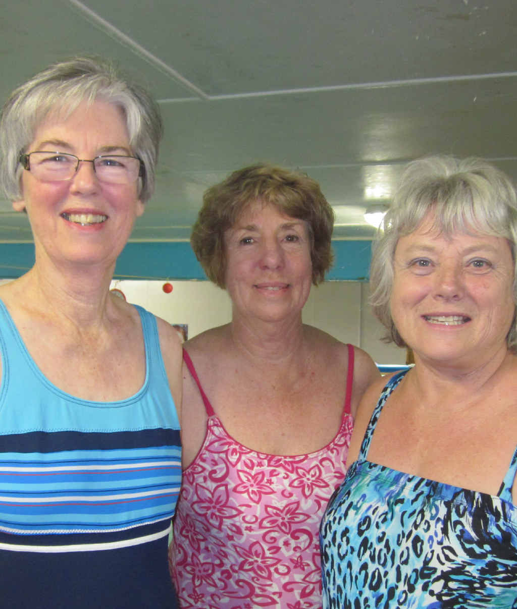 POOL SAFETY: Instructor Helen Pye (right) with students who have graduated from a Water-Confidence Course to a Swimming-Confidence Course. The women now swim lengths of a splash pool each week during classes. Photo: Contributed