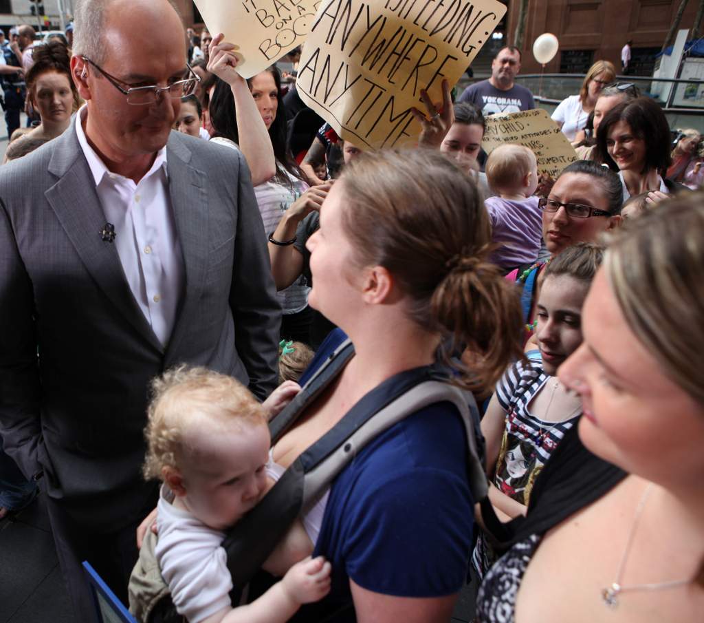 Breakfast TV personality David Koch talks with a mum protesting his Breakfast TV personality David Koch talks with a mum protesting his