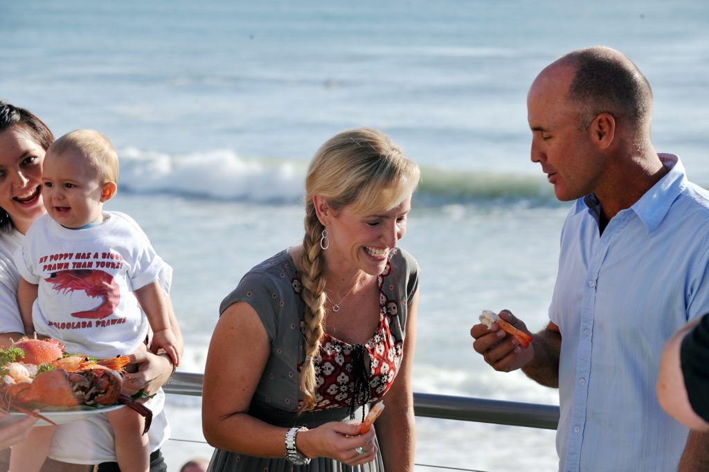Sunrise weather presenter Fifi Box did a live cross from Mooloolaba. Fifi shares a prawn and a joke with former ironman Grant Kenny. Photo Warren Lynam / Sunshine Coast Daily Sunrise weather presenter Fifi Box did a live cross from Mooloolaba. Fifi shares a prawn and a joke with former ironman Grant Kenny. Photo Warren Lynam / Sunshine Coast Daily