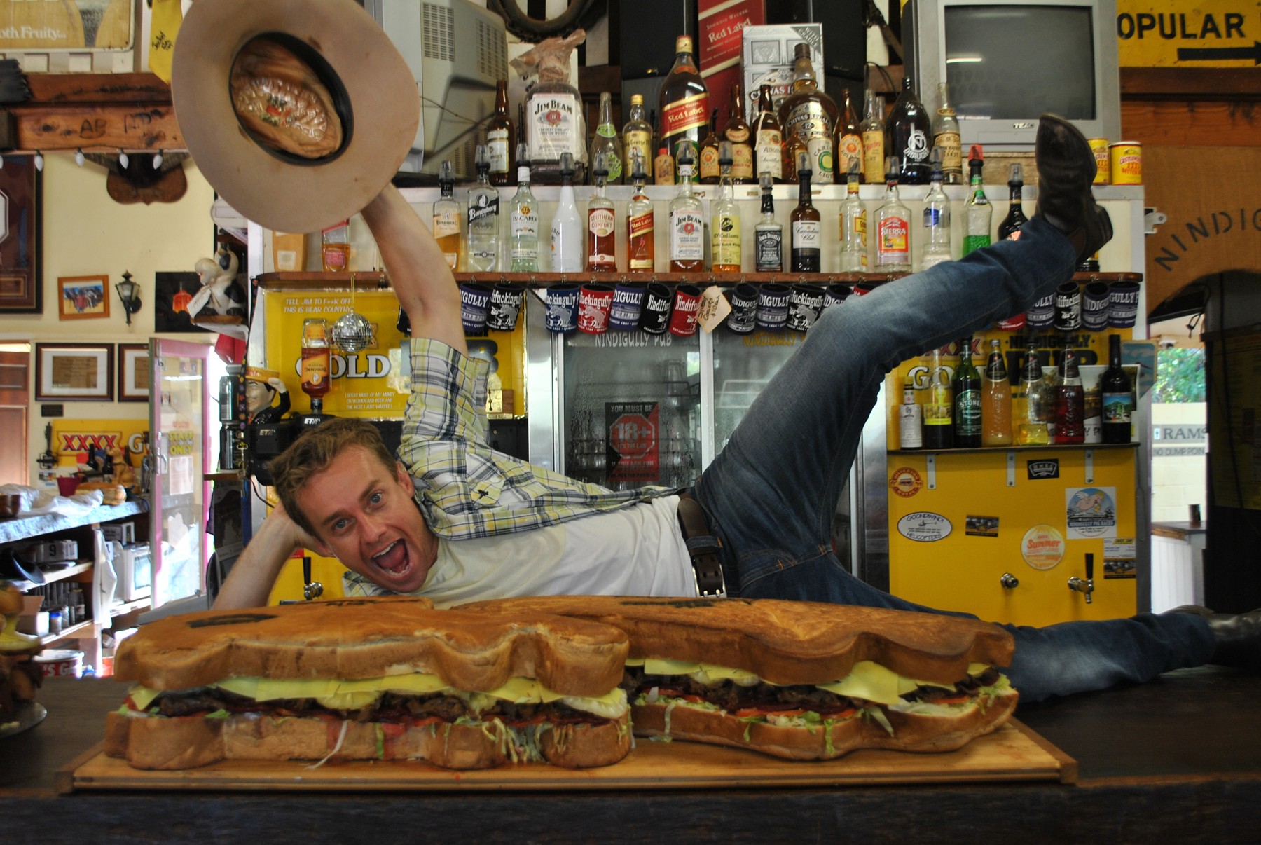 MACK ATTACK: Sunrise weatherman Grant Denyer hams it up for the camera with the Nindigully Pub's 24-kilogram goliath, the Real Big Mack. MACK ATTACK: Sunrise weatherman Grant Denyer hams it up for the camera with the Nindigully Pub's 24-kilogram goliath, the Real Big Mack.