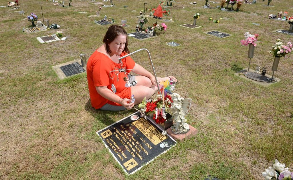 Mary Beck at her daughter's grave at Warrill Park Cemetery. Mary is upset that the cemetery management have placed letters on graves asking for all trinkets to be removed from graves. Mary Beck at her daughter's grave at Warrill Park Cemetery. Mary is upset that the cemetery management have placed letters on graves asking for all trinkets to be removed from graves.