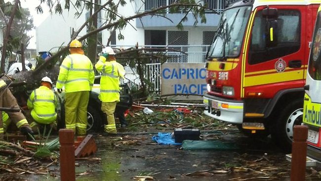 Channel 7 Bundaberg posted this photo on Twitter which shows emergency crews working to free a man trapped in his car after a pine tree fell on the vehicle during a mini-tornado. Pippa Bradshaw/ Channel 7 Channel 7 Bundaberg posted this photo on Twitter which shows emergency crews working to free a man trapped in his car after a pine tree fell on the vehicle during a mini-tornado. Pippa Bradshaw/ Channel 7