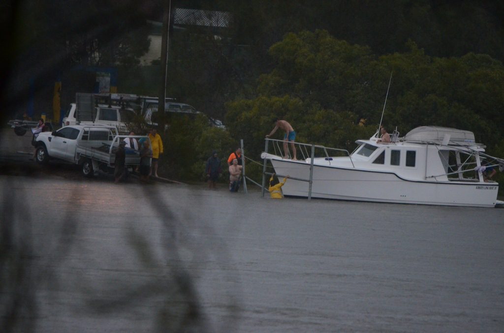People moving a house boat out of the Boyne River just before 7am. People moving a house boat out of the Boyne River just before 7am.