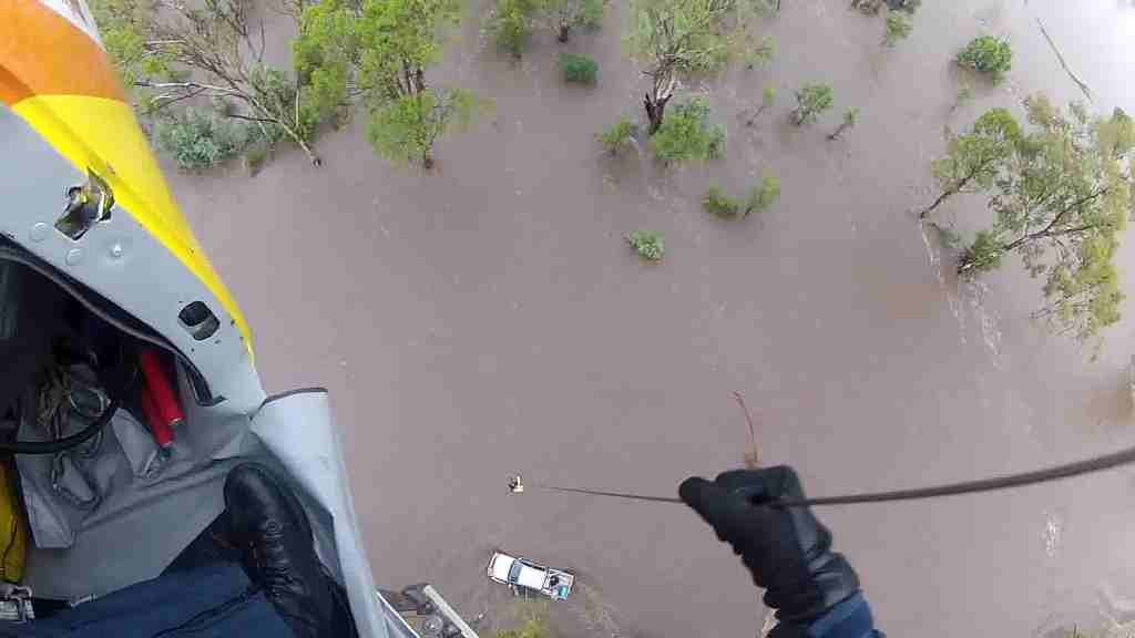 Two women and a 14-month-old child have been saved from floodwater by the Rescue 300 crew. Two women and a 14-month-old child have been saved from floodwater by the Rescue 300 crew.
