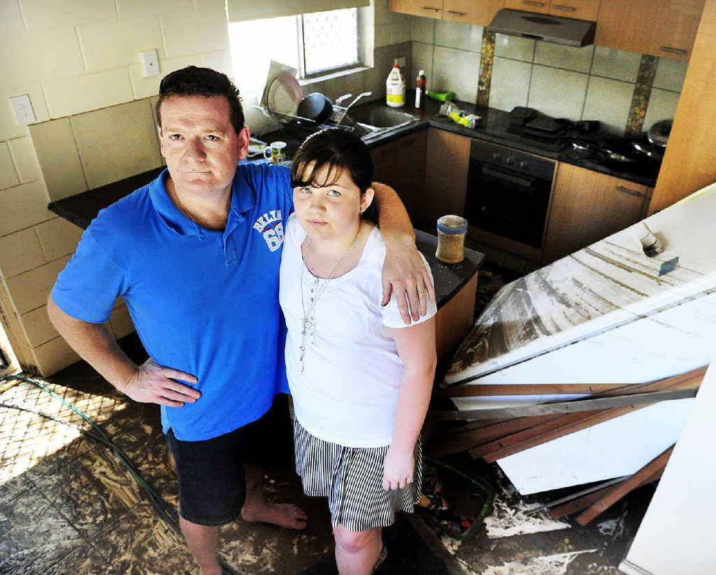 HEARTBREAK: Jose and Ashleigh Alonso in their Darling St West home that was inundated on Monday. HEARTBREAK: Jose and Ashleigh Alonso in their Darling St West home that was inundated on Monday.