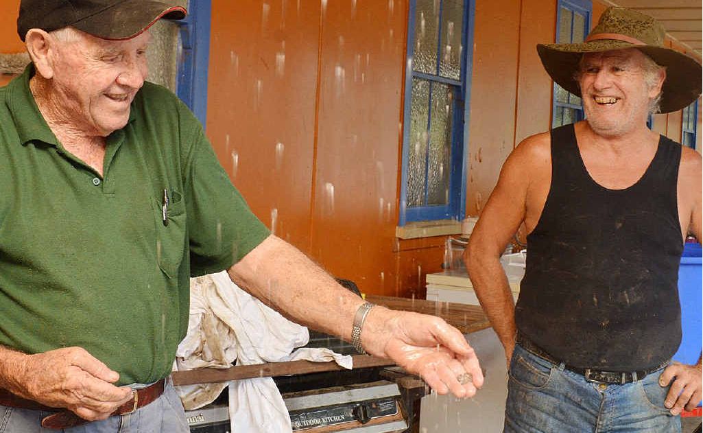 Bill Clark Coolee and Wilson Ellis are still smiling despite the massive job in front of them cleaning up the Woolooga pub. Bill Clark Coolee and Wilson Ellis are still smiling despite the massive job in front of them cleaning up the Woolooga pub.