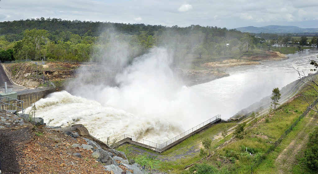 OPEN SEASON: Water is released from the floodgates at Wivenhoe Dam yesterday. OPEN SEASON: Water is released from the floodgates at Wivenhoe Dam yesterday.