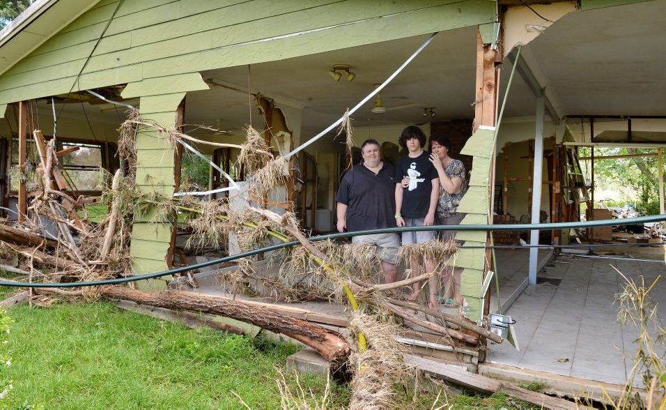 Ian, Maureen and son Bryce Sharkey at their Lower Wonga house destroyed by flood waters. Ian, Maureen and son Bryce Sharkey at their Lower Wonga house destroyed by flood waters.